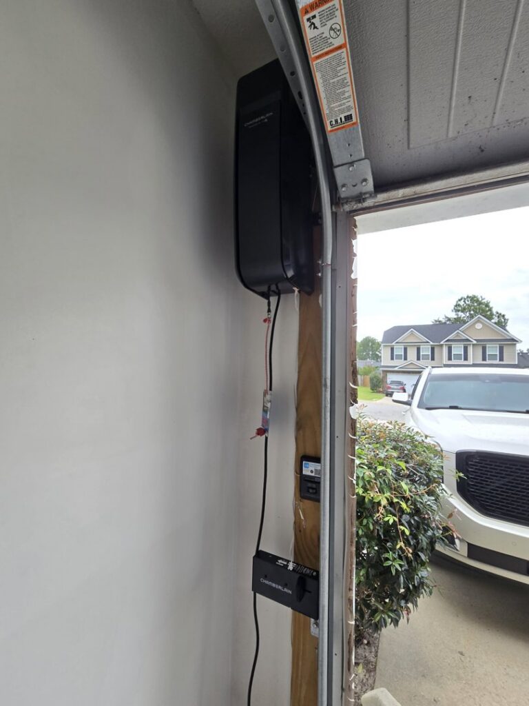 A wall-mounted garage door opener installation by Coles Garage Door Service, LLC in West Columbia, SC.