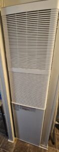 A wall-mounted furnace or heater unit, serviced by G.M. AIR Conditioning & Heating in Wichita, KS.