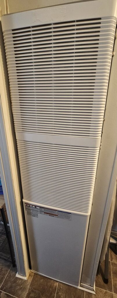 A wall-mounted furnace or heater unit, serviced by G.M. AIR Conditioning & Heating in Wichita, KS.
