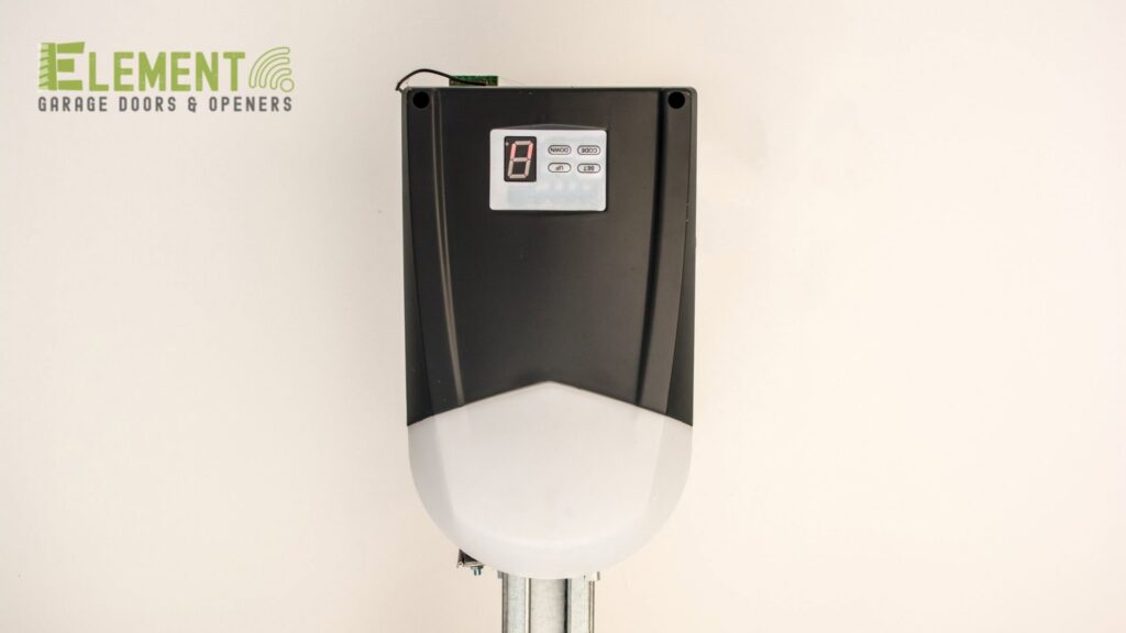A modern wall-mounted control panel for a garage door opener, installed by Element Garage Door Repair Of Portland, OR