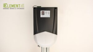 A modern wall-mounted control panel for a garage door opener, installed by Element Garage Door Repair Of Portland, OR