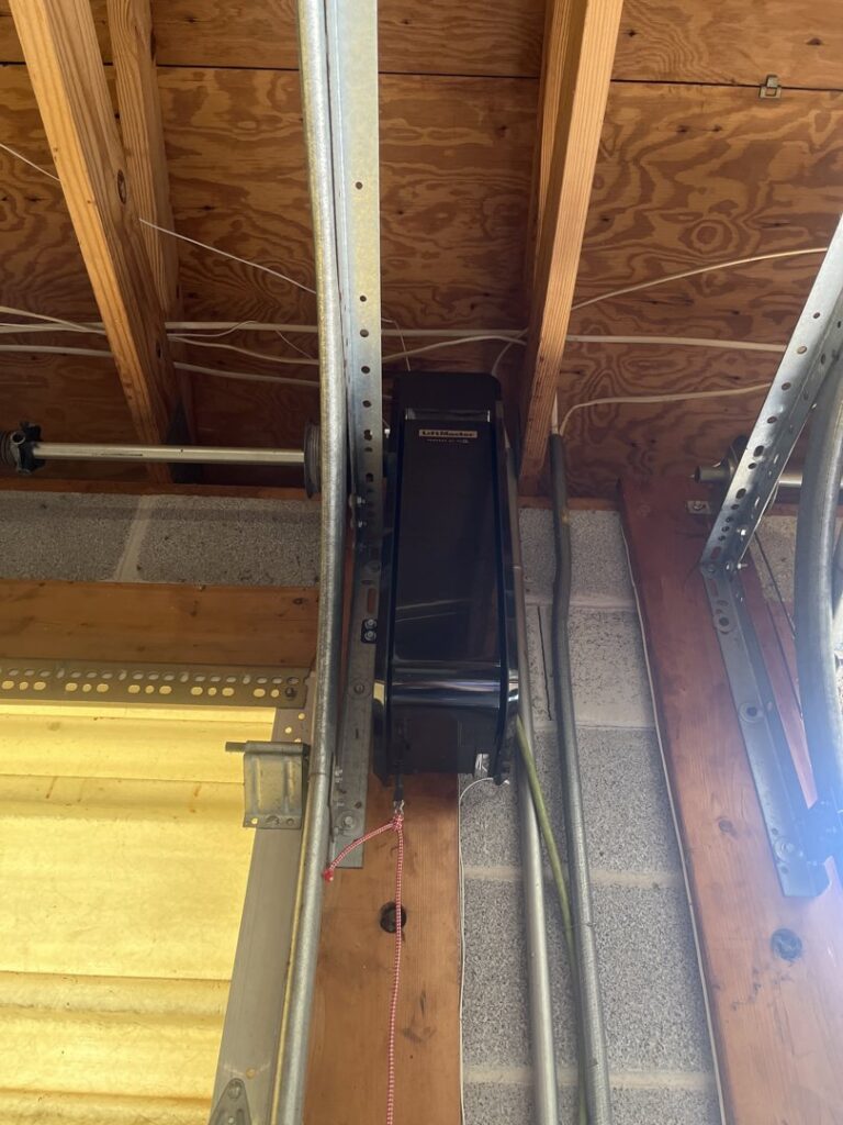 A wall-mounted LiftMaster garage door opener installation by Door Serv Pro in Inwood, WV.