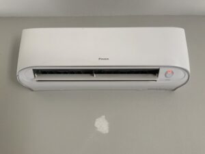 A white Daikin wall-mounted mini-split air conditioning unit installed indoors by Chill Out Heating and Cooling in Tulsa, OK.