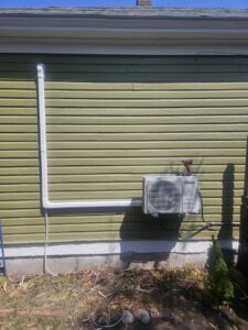 A wall-mounted mini-split condenser unit installed by 406 Heating & Cooling LLC in Missoula, MT.