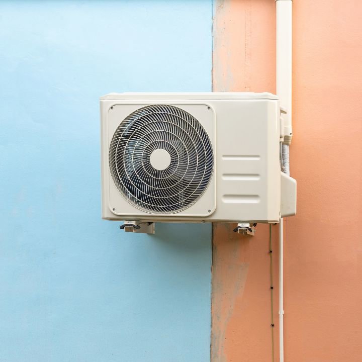 A wall-mounted mini-split air conditioning condenser unit by All The Way Heating & Cooling in Middleburgh, NY
