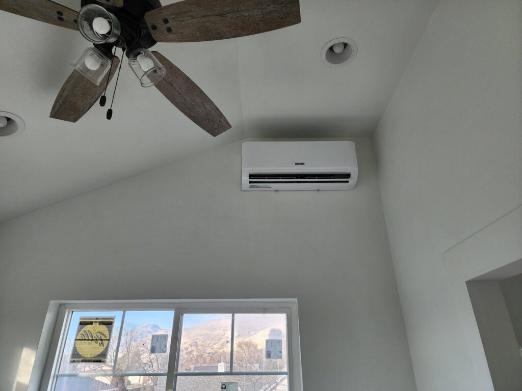 A wall-mounted mini-split HVAC unit installed in a room by Cutting Edge HVAC LLC in Orem, UT.