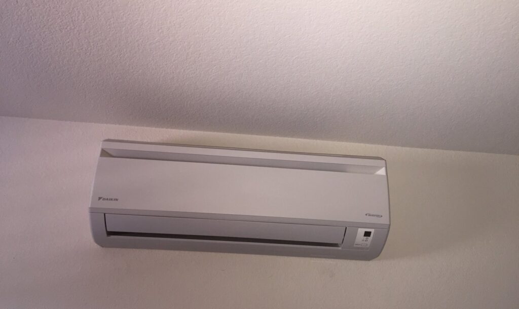 A wall-mounted Daikin mini-split HVAC indoor unit installed by DeHart Plumbing, Heating, & Air in Sparks, NV.