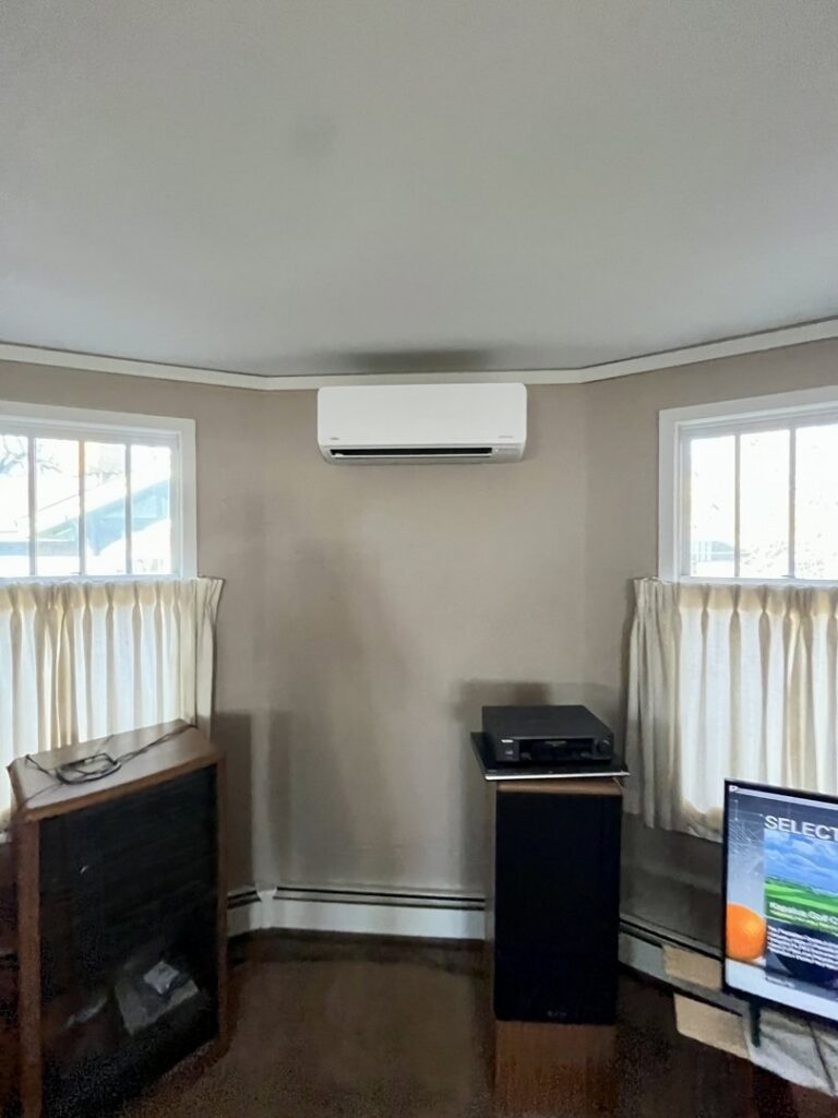 A sleek wall-mounted mini-split HVAC unit professionally installed by Just Heat Pumps in a Denver, CO home.