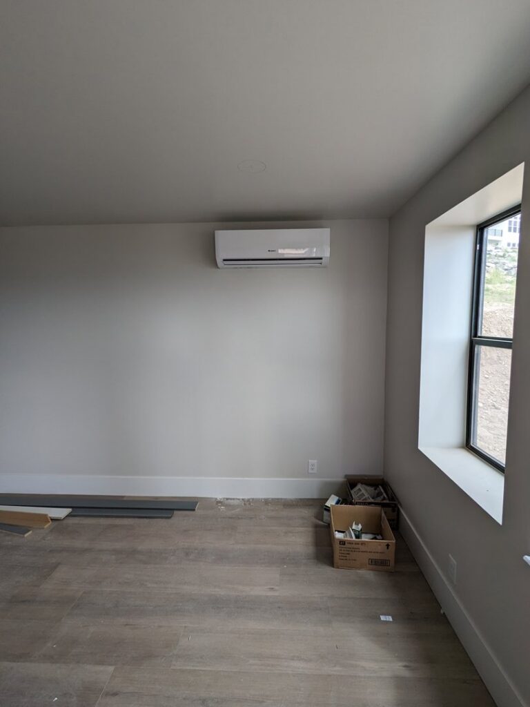 A wall-mounted mini-split indoor unit installed in a room by Inspector Rogers LLC in Draper, UT.
