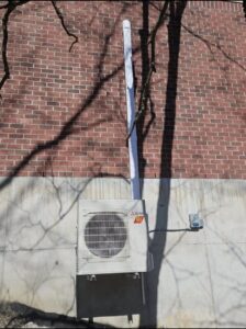 A wall-mounted Mitsubishi mini-split outdoor unit installed by Pike Mechanical in Vevay, IN.
