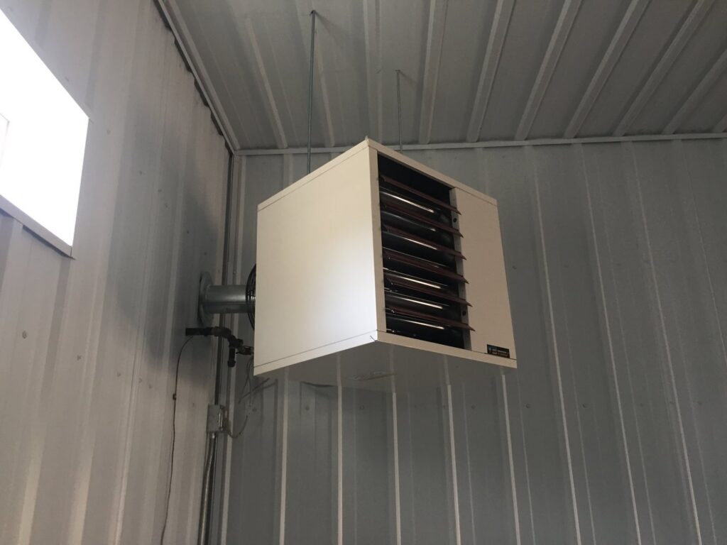 A wall-mounted unit heater installed in a garage or workshop by Butte Heating & Cooling in Rapid City, SD.