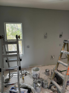 Wall sconce light fixtures and electrical outlet boxes installed in a room under construction by Break-N-Run Services in Henderson, NV.