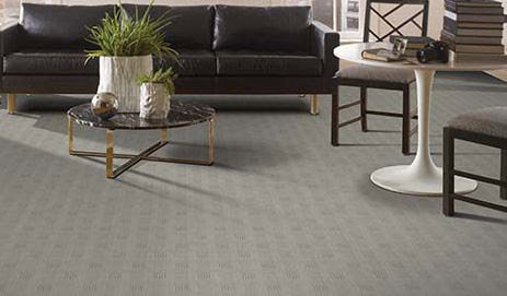 A modern living room featuring a newly installed wall-to-wall carpet by Carolina Carpet, Hardwood & Tile in Mount Pleasant, SC