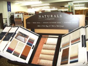 Display of wall-to-wall carpet and rug samples from Naturals by Stanton at Custom Crafted Floors in Phoenix, AZ.
