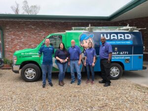 The Ward Mechanical Contractors team standing proudly in front of their branded service van in Denham Springs, LA.