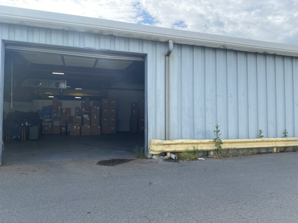 Exterior view of the Murray Filter Sales and Service, Inc. warehouse with an open bay door showing inventory in Nashville, TN