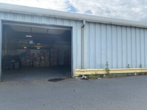 Exterior view of the Murray Filter Sales and Service, Inc. warehouse with an open bay door showing inventory in Nashville, TN