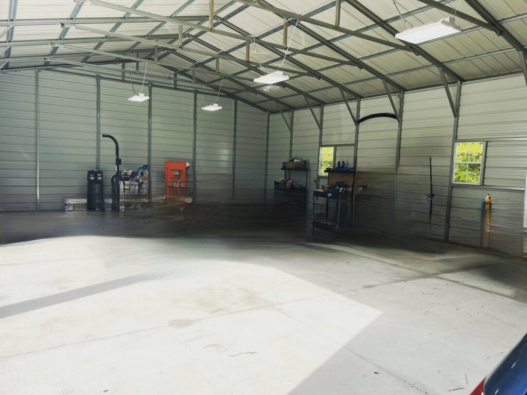 New fluorescent or LED shop lights installed in a large warehouse or garage by ALC Electric LLC in Goose Creek, SC