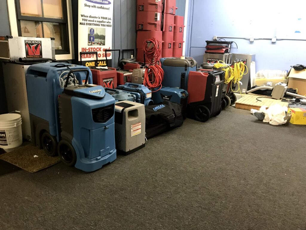 Industrial drying and dehumidifying equipment for water damage restoration on a carpeted floor by Mark it Clean Carpet & Upholstery Cleaning Long Beach, CA.