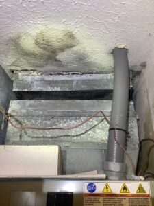 Water-damaged ceiling and ductwork, indicating an HVAC issue, addressed by Family Heating & Air Conditioning in Indianapolis, IN.