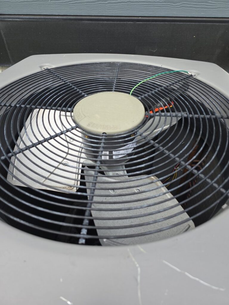 A water heater installed next to a furnace unit, showing comprehensive home heating services by 24/7 Heating & Air, LLC in Grand Island, NE.