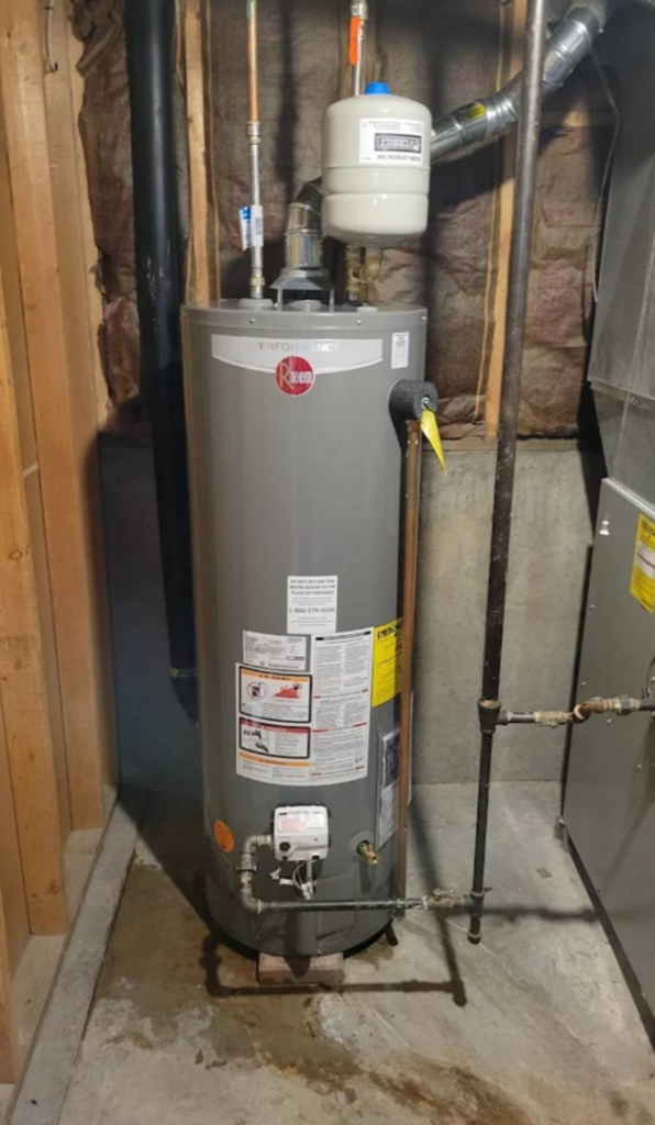 A new Rheem water heater and part of a furnace installed by ESR Heating, Cooling and Refrigeration in Raymore, MO.
