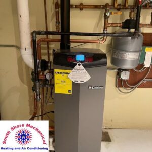 A modern water heater or boiler unit with copper piping installed by South Shore Mechanical in Abington, MA