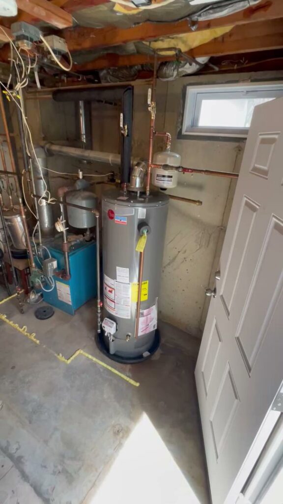 A water heater and boiler system in a basement, serviced by MAC Heating and Cooling LLC in Waterbury, CT.