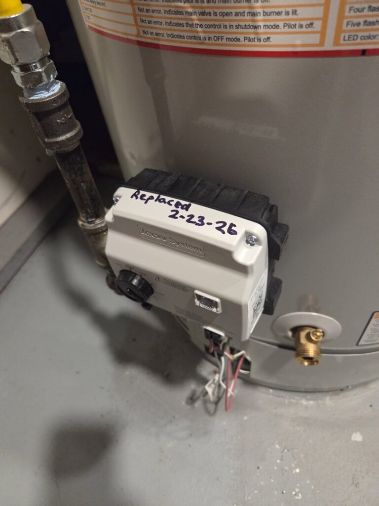 A close-up of a water heater control unit that was replaced by David J. Winston Co. in Erie, PA.