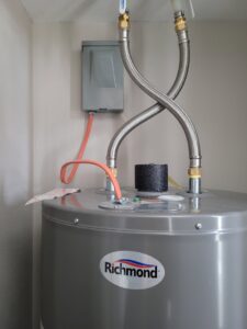 Electrical connection to a water heater with conduit and junction box by FOXX & Hounds Electric in Sioux City, IA.