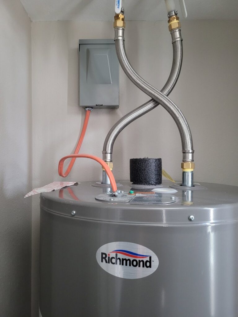 Electrical connection to a water heater with conduit and junction box by FOXX & Hounds Electric in Sioux City, IA.