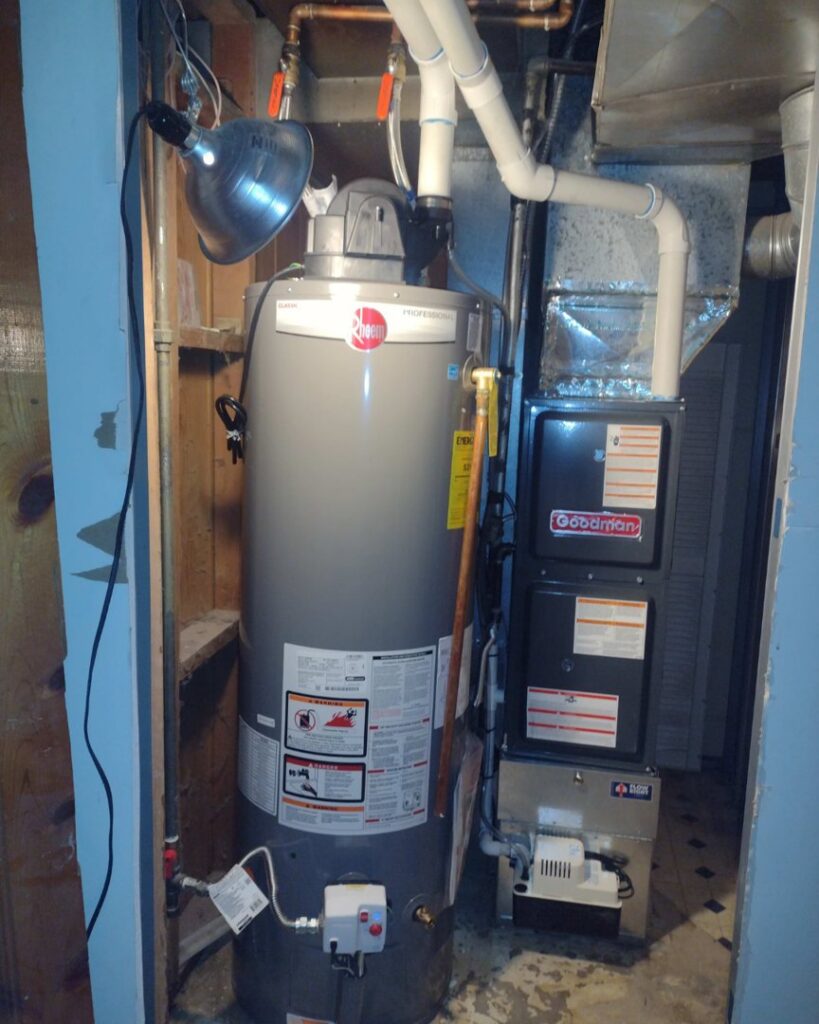 A new water heater and furnace installed in a utility closet by Jump HVAC in Lakewood, CO.