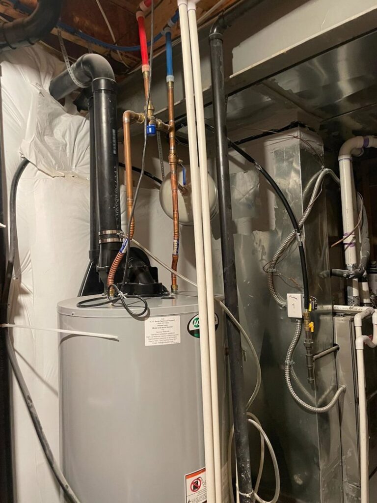 A water heater and furnace installation in a utility area by National Heating & Cooling Company in Lakewood, CO.