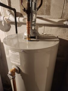A new water heater installation in a basement by Miracle Plumbing, Heating & Cooling in Canton, OH.