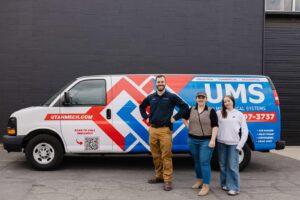 Two water heaters installed in a utility room by Utah Mechanical Systems in South Ogden, UT.