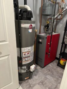 A water heater and a red boiler system installed by Russell Climate Solutions in Schenectady, NY.