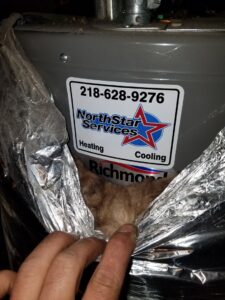 A water heater with a NorthStar Services sticker, indicating service or installation by the company in South Haven, MN