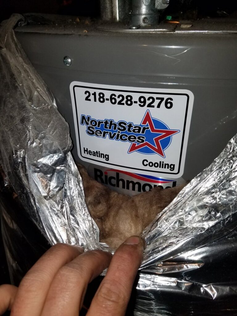 A water heater with a NorthStar Services sticker, indicating service or installation by the company in South Haven, MN