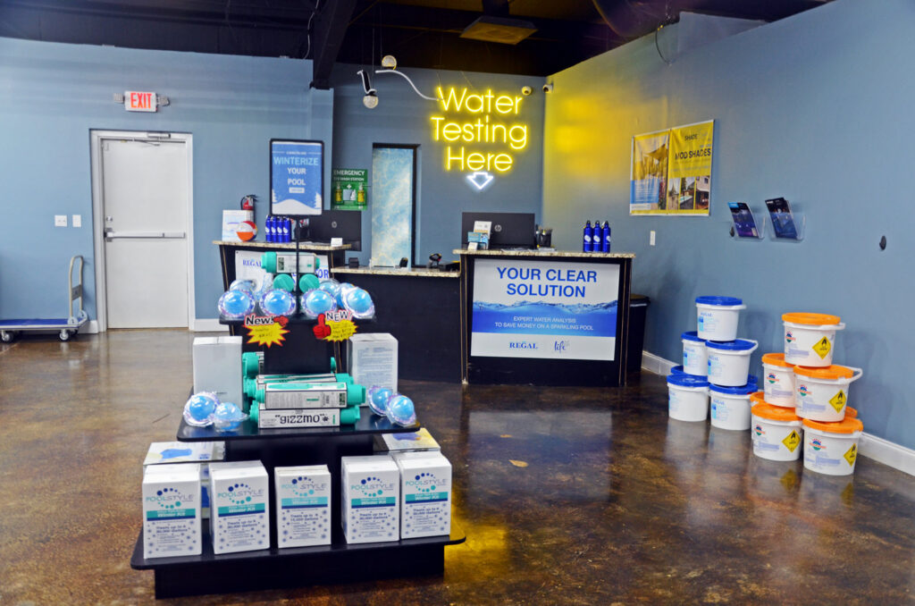 Interior of Alabama Pool Kings in Madison, AL, featuring a water testing station and pool maintenance supplies.