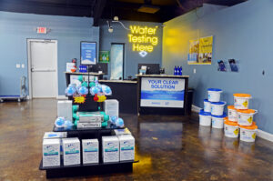 Interior of Alabama Pool Kings in Madison, AL, featuring a water testing station and pool maintenance supplies.