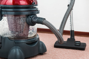 A water-based vacuum cleaner on a light-colored carpet, demonstrating services by Philadelphia Carpet Cleaning Co in Lansdowne, PA.