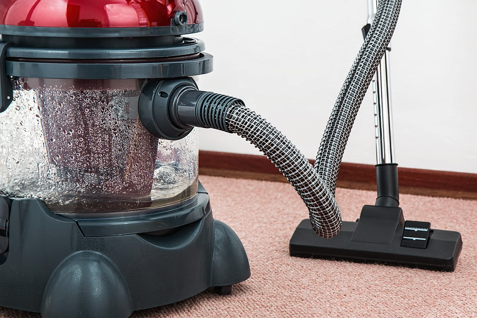 A water-based vacuum cleaner on a light-colored carpet, demonstrating services by Philadelphia Carpet Cleaning Co in Lansdowne, PA.