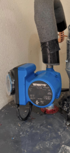 A Watts circulation pump installed as part of a heating system by NM Heating and Air in Albuquerque, NM.