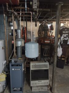 A Weil-McLain boiler and heating system with an expansion tank, installed or serviced by Delgado Enterprises in Pittsburgh, PA