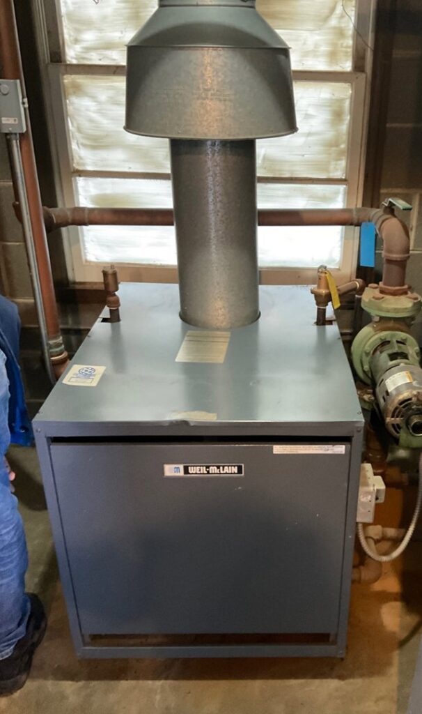 A Weil-McLain boiler unit, likely installed or serviced by Service Pro Titans in Chicago, IL.