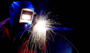 A welder performing work that supports HVAC system installation for Ray Martin Company of Omaha, NE