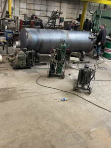 Welding on a large industrial pressure vessel at Capital City Boiler & Machine Works, Inc. in Des Moines, IA