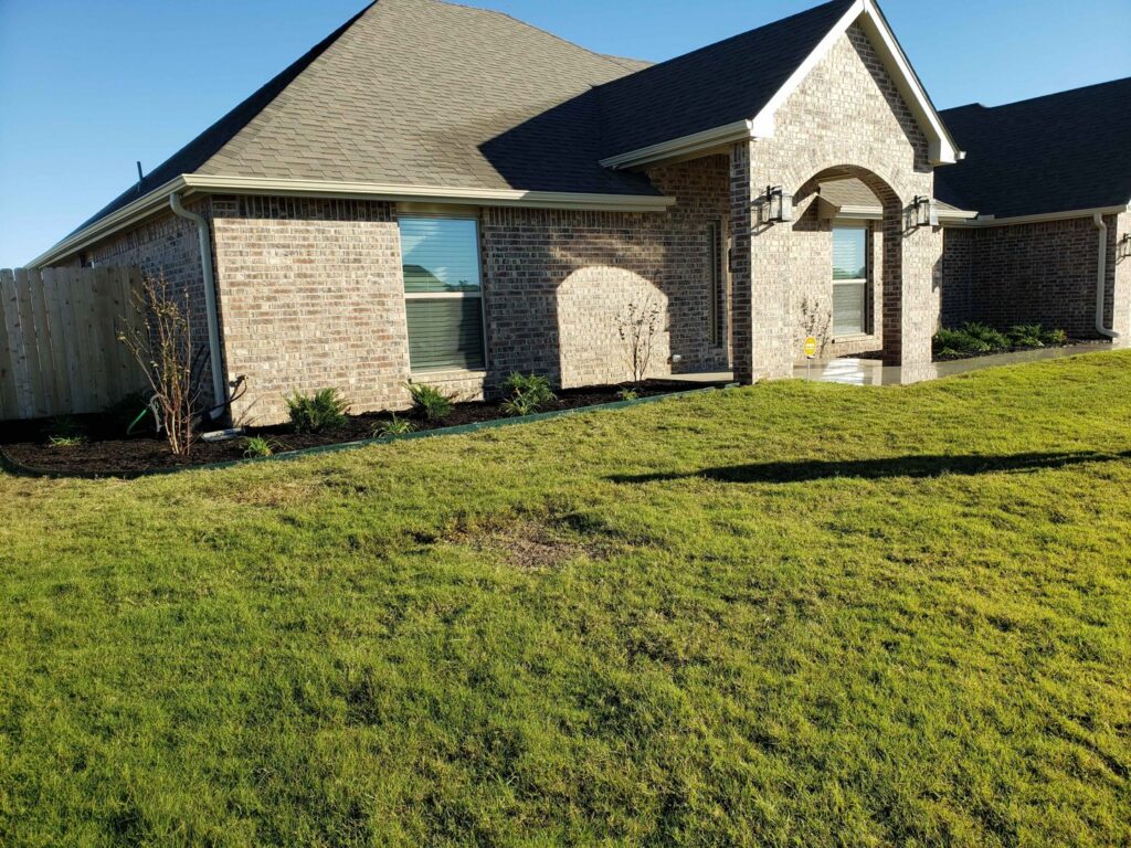 A beautifully well-maintained front yard and lawn by GAMAS Lawn Care Services in Tulsa, OK.