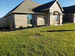 A beautifully well-maintained front yard and lawn by GAMAS Lawn Care Services in Tulsa, OK.