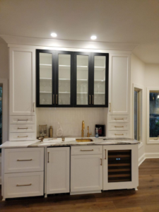 Recessed and under-cabinet lighting, and wine fridge electrical connection in a wet bar by D&R Construction & Electrical Services in Summerville, SC.